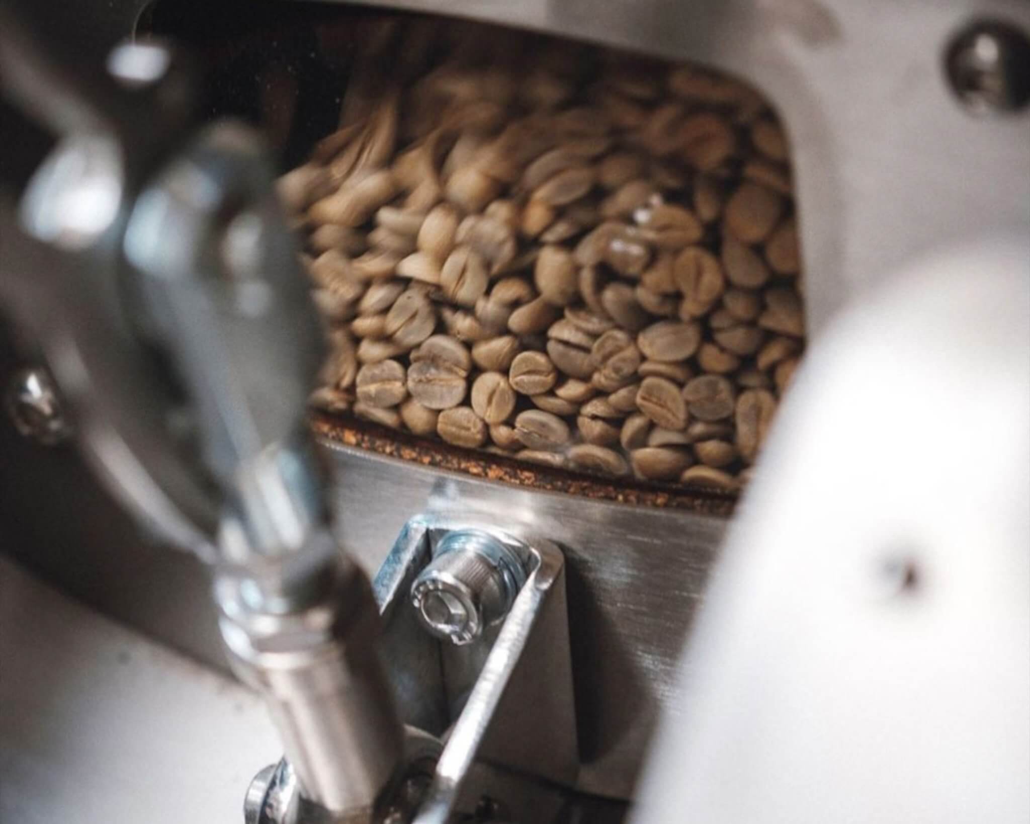 Coffee beans being roasted in roasting machine 39 Steps Coffee